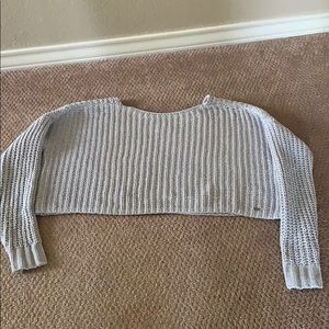 A woman’s cropped sweater